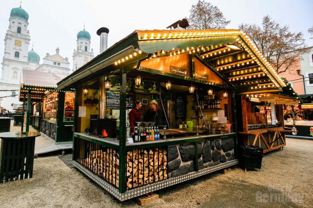 Food Stall at a German Christmas Market with a church in the background