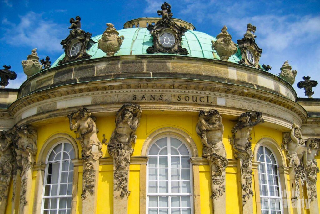 Close up to the Sanssouci Palace in Potsdam Germany. On the exterior wall it is written Sans Souci.